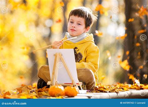 Cute Little Boy Painting In Golden Autumn Park Stock Photo Image Of