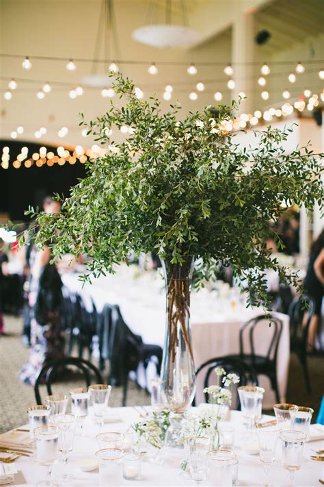 Tall Centerpieces with Greenery | Tall centerpieces, Tall wedding centerpieces, Green wedding ...