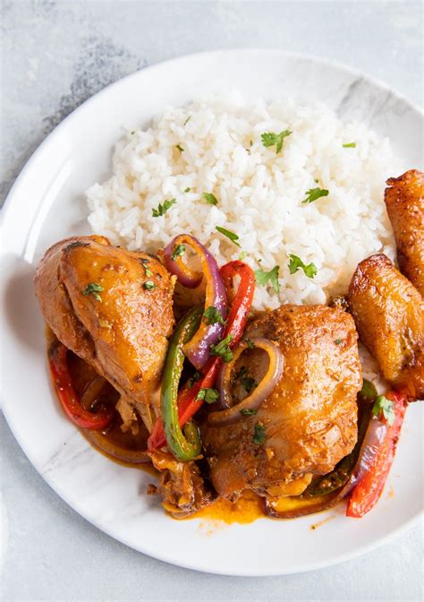 Dominican Braised Chicken Or Pollo Guisado Served On A Plate With White