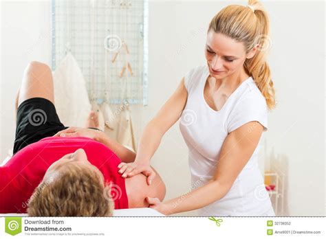 Patient At The Physiotherapy Doing Physical Therapy Stock
