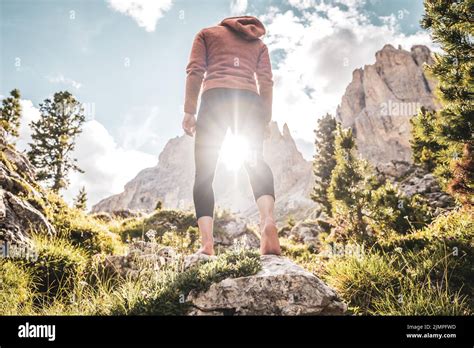 Woman Walking Barefoot Through Mountain Forest In The Dolomites Stock