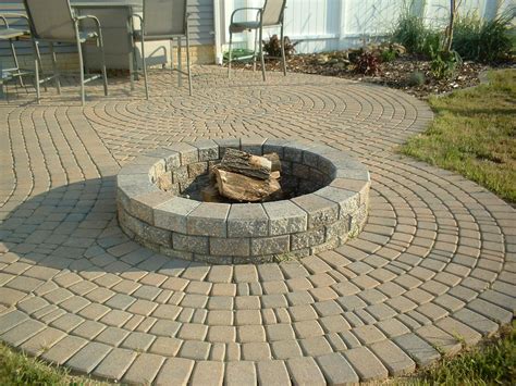 The table at the centre and the natural brick furniture around it is an impeccable match. Paver Patio With Fire Pit | Fire Pit Design Ideas