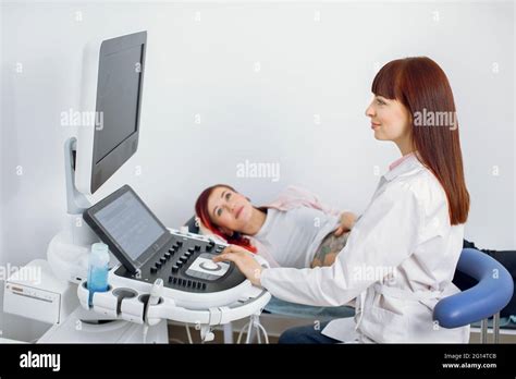 Portrait Of High Skilled Professional Female Caucasian Obstetrician Doctor Examining Pregnant