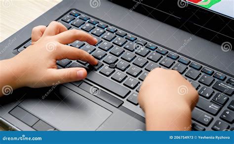 Closeup Video Of Small Child Hand And Finger Pressing Buttons On Laptop