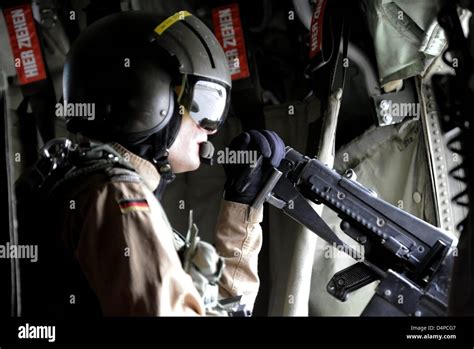 A So Called Doorgunner Observes The Surroundings During A Flight In A