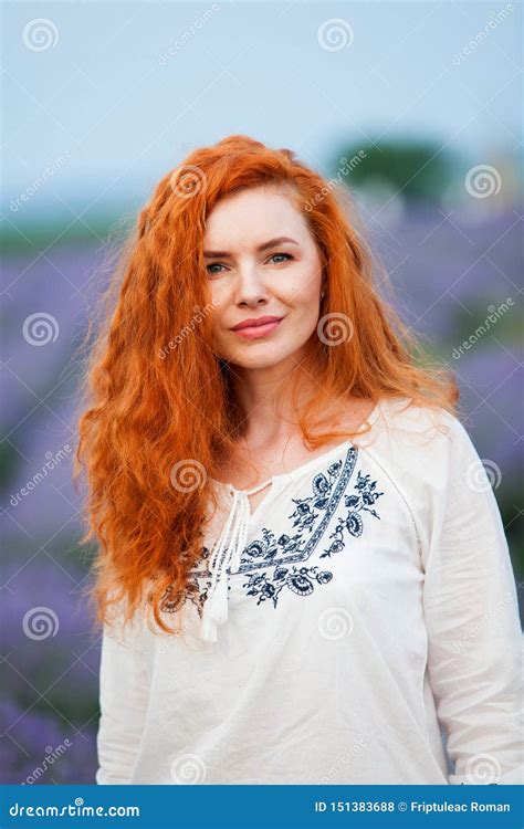 Summer Portrait Of A Beautiful Girl With Long Curly Red Hair Stock