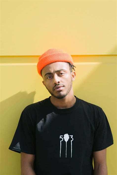 Download Amine Rapper Pfp With Yellow Wall Wallpaper