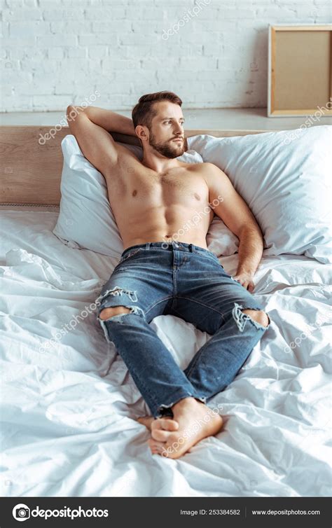 Handsome Muscular Man Lying Bed Looking Away Bedroom Stock Photo By
