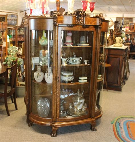 Antique Oak China Curio Cabinet With Detailed Lions Heads Bargain