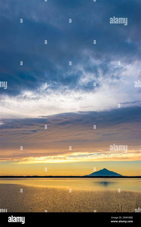 Sunset Over Sarobetsu Plain And Silhouette Of Rishiri Fuji Seen From