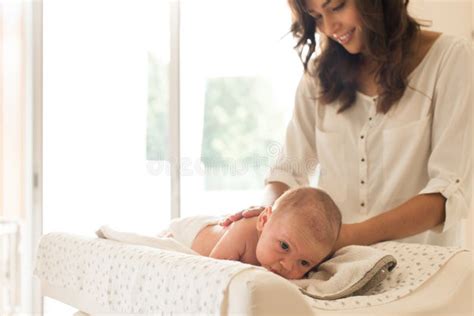 Mother Changing Baby S Diaper Stock Photo Image Of Newborn White