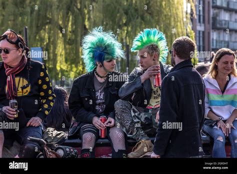 Punks Sit On The Bridge Over Camden Lock In The Popular Tourist