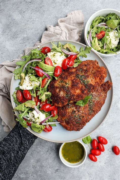 Transfer the chicken to a clean cutting board. easy chicken milanese with arugula salad | cait's plate