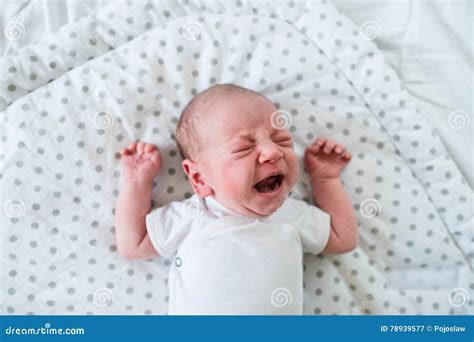 Newborn Baby Boy Lying On Bed Crying Close Up Stock Image Image Of