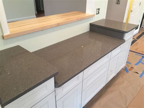 It's a soft white with light grey veins, giving just a hint of a pattern. Quartz / Silestone , Grey Silestone with Silver Sparkles - Hesano Brothers