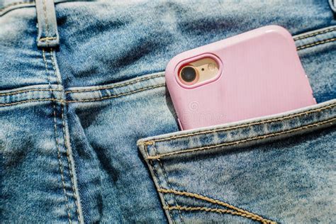 Modern Smartphone In The Pocket Of Jeans Close Up Cell Phone In The