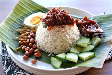My nasi lemak consists of sambal, fried baby ikan bilis, cucumber slices, roasted peanuts, boiled egg and turmeric chicken. Nasi Lemak With Dried Anchovies Sambal (Sambal Ikan Bilis)