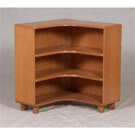 Refinished in a clear coat that unlike the original champaign finish let's a bit more of the solid maple show through. HEYWOOD-WAKEFIELD CORNER BOOKCASE MODERN