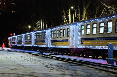 Scenic View Of Christmas Decorated Train By Lights Train Arrived At