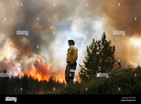 Firefighter Alex Abols Monitors Fire On The North Flank Of The