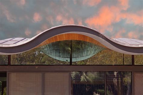 Modern Glass House Sports Floating Wavy Roof Curbed