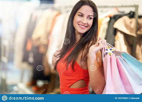 happy woman shopping for clothes in store stock image image of shoes cellphone 143750051