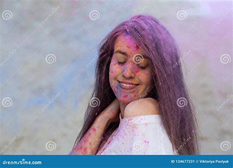 Closeup Portrait Of Joyful Brunette Model Celebrating Holi Colors Festival At The Desert Empty