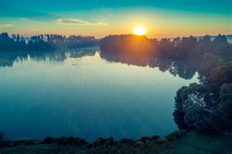Early Morning Sunrise Over The Lake Stock Photo Image Of Lake Mist