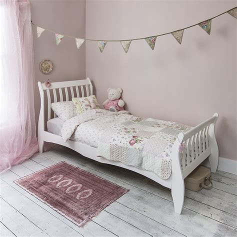 Ex display white wood single bed frame. Astrid Single Sleigh Bed in White | Noa & Nani