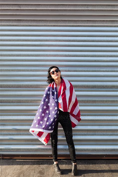 Attractive Brunette With The American Flag Del Colaborador De Stocksy