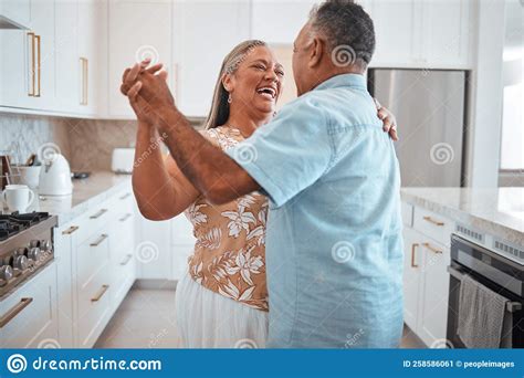 Happy Senior Couple Dance And Laughing In Joyful Happiness For