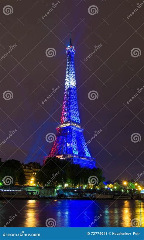 The Eiffel Tower Lit Up In Color Of French Flag Paris France