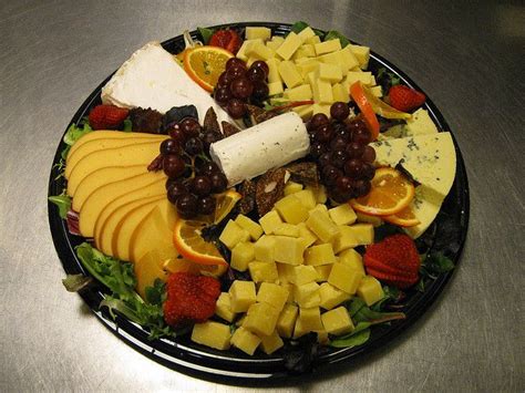 Andre cow cheese, dried fruit mix, roasted grape. Gourmet Cheese Platter | Whole food recipes, Gourmet ...