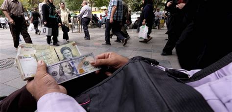 Money Changer Displays U S And Iranian Banknotes At The Grand Bazaar