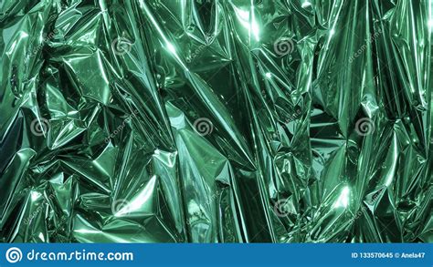Green Metal Foil Wrinkled And Shiny Close Up Abstract Image
