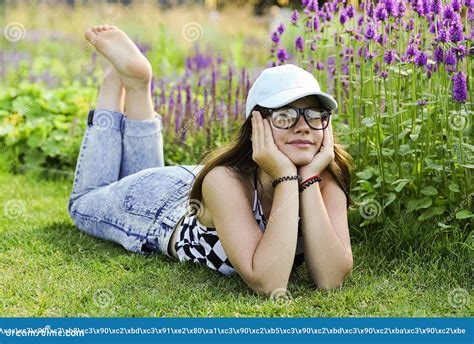 Barefoot Girl Lying In Grass