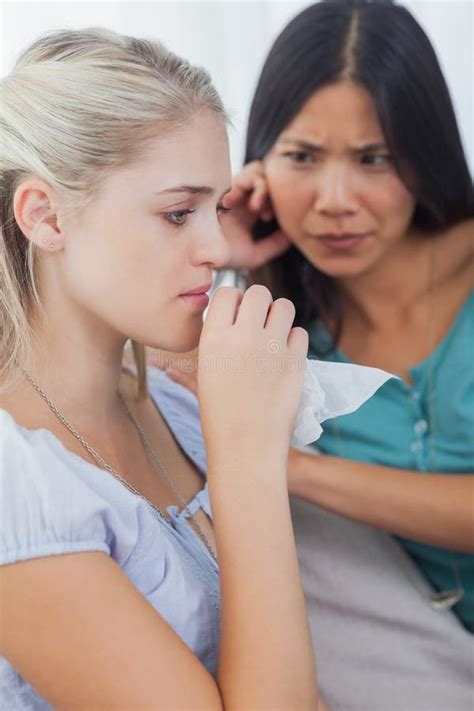 Blonde Crying And Talking As Her Concerned Friend Is Listening Stock