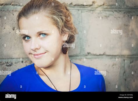 Young Blue Eyed Girl Near Brick Wall Stock Photo Alamy