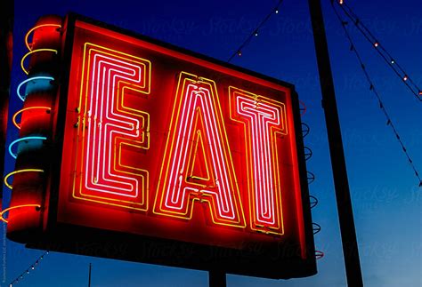 Neon Eat Sign On At Diner Del Colaborador De Stocksy Raymond Forbes