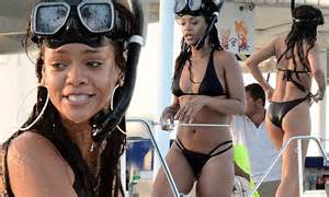 Rihanna Shows Off Her Flawless Figure In A Halter Neck Bikini During A