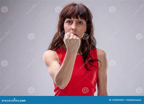 Angry Woman Gesturing With Her Clenched Fist Stock Photo Image Of