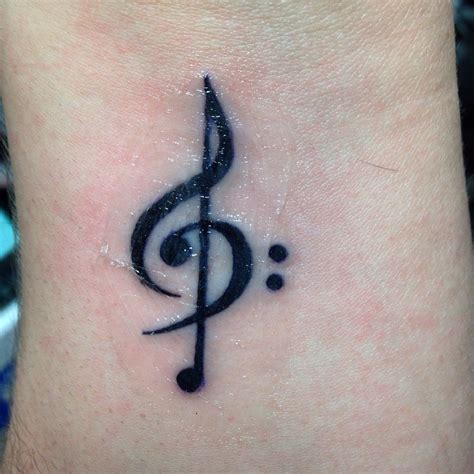 It is very bright and full of life. Treble clef, bass clef, quarter note tattoo | Violin tattoo, Music tattoo designs, Tattoos