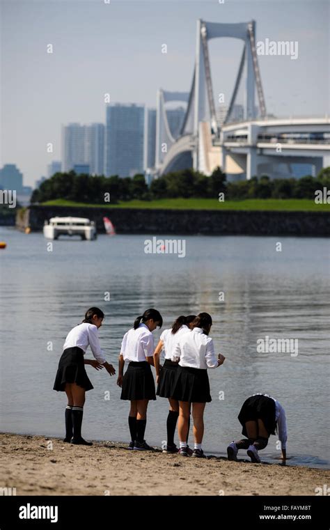 Japanese Girls Playing On Odaiba Beach On The Sumida River Tokyo Japan