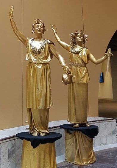 Golden Statues Cirque Mystique