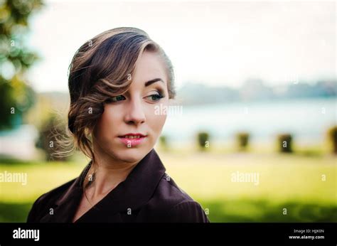 Close Up Face Portrait Of Smart Girl With Old Fashioned Hairstyle