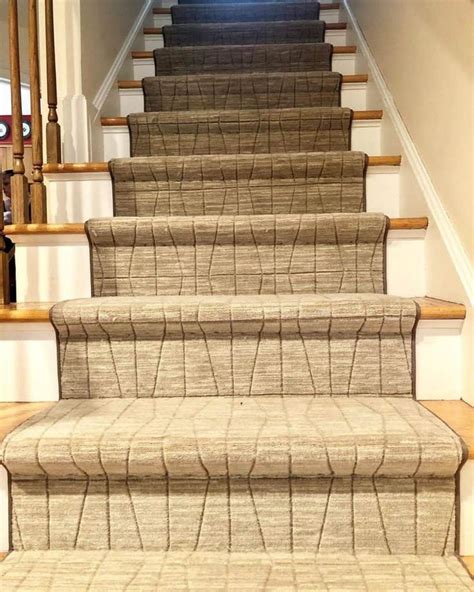 The Carpeted Stairs Are Lined With Beige Rugs