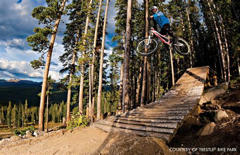 Many of the best ski resorts turn into downhill mountain bike parks in the summer. Trestle Downhill Mountain Bike Trail, Winter Park, Colorado