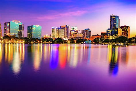 Orlando City Reflections And Vibrant Lake Eola Park Sunset Photograph