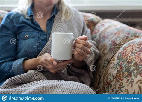 Warm Cup Of Hot Coffee Warming In The Hands Of A Girl Stock Photo