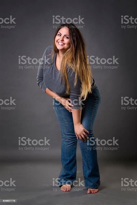 Young Beautiful Plus Size Model In Blue Jeans Xxl Woman Stock Photo